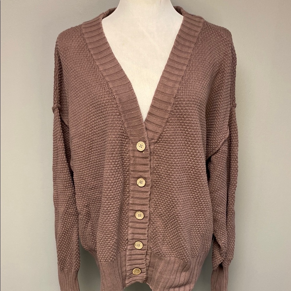 Pink Cardigan Sweater with Deep V-Neck and Ribbed Detailing